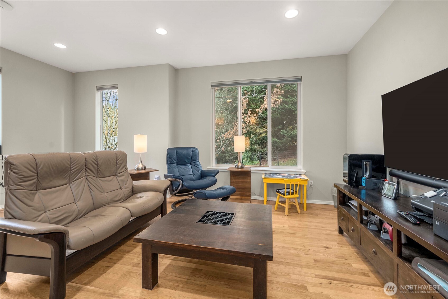 3723 Lincoln Court Northeast Renton, WA 98056 - Photo 9 of 37 a living room with furniture flat screen tv and a large window
