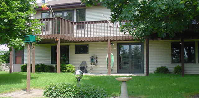 9629 Rambouillet Ridge Roscoe, IL 61073 - Photo 6 of 6 a front view of a house with a garden