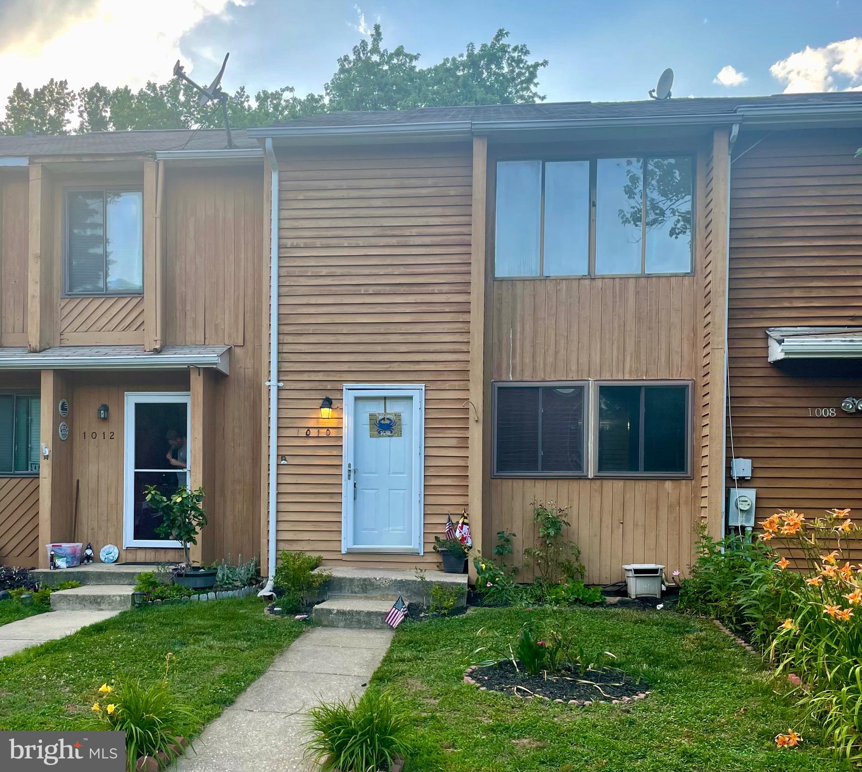 a view of a house with a yard and a large window