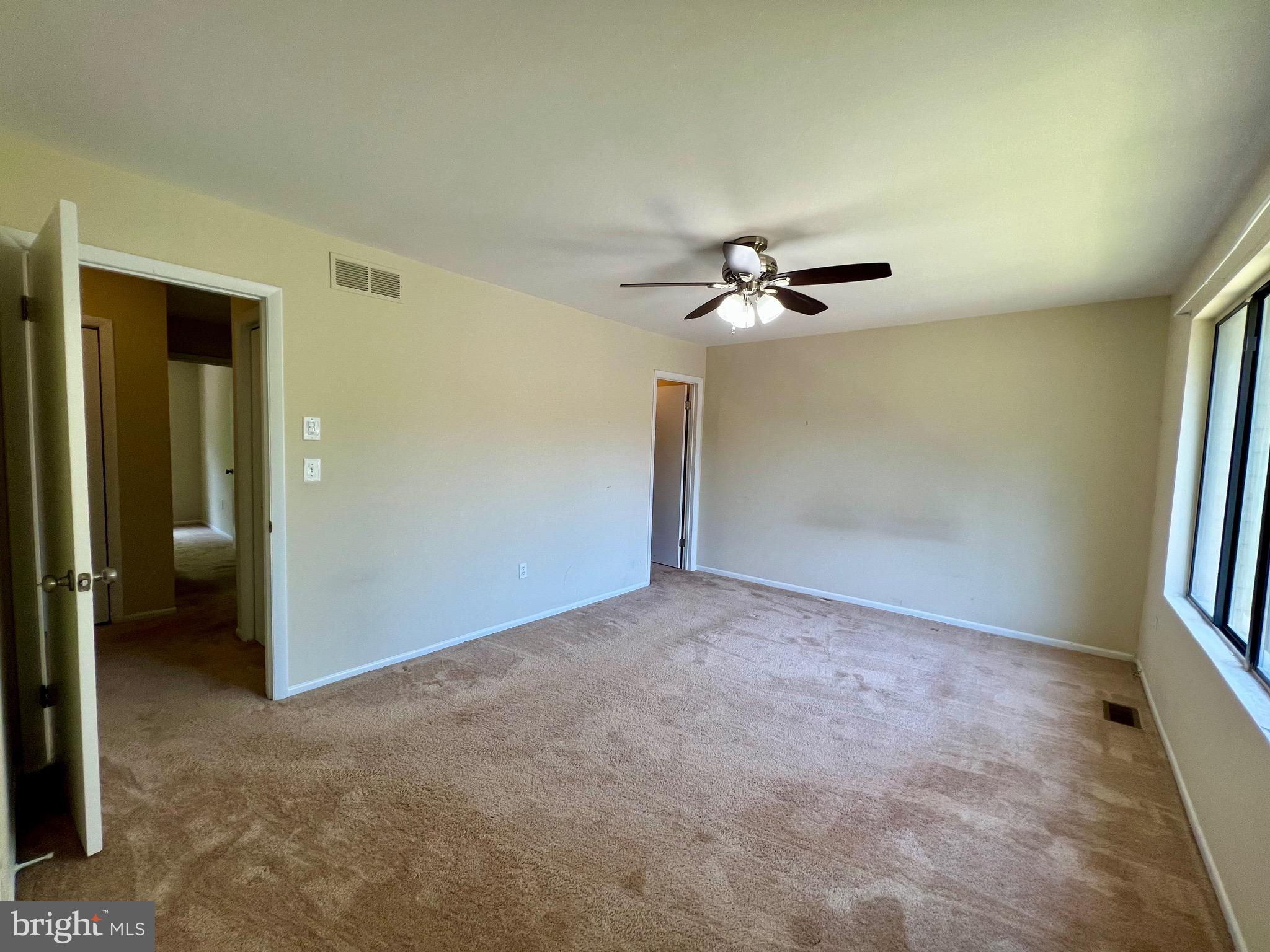 1010 Commanders Way North Annapolis, MD 21409 - Photo 20 of 33 an empty room with a ceiling fan and a rug