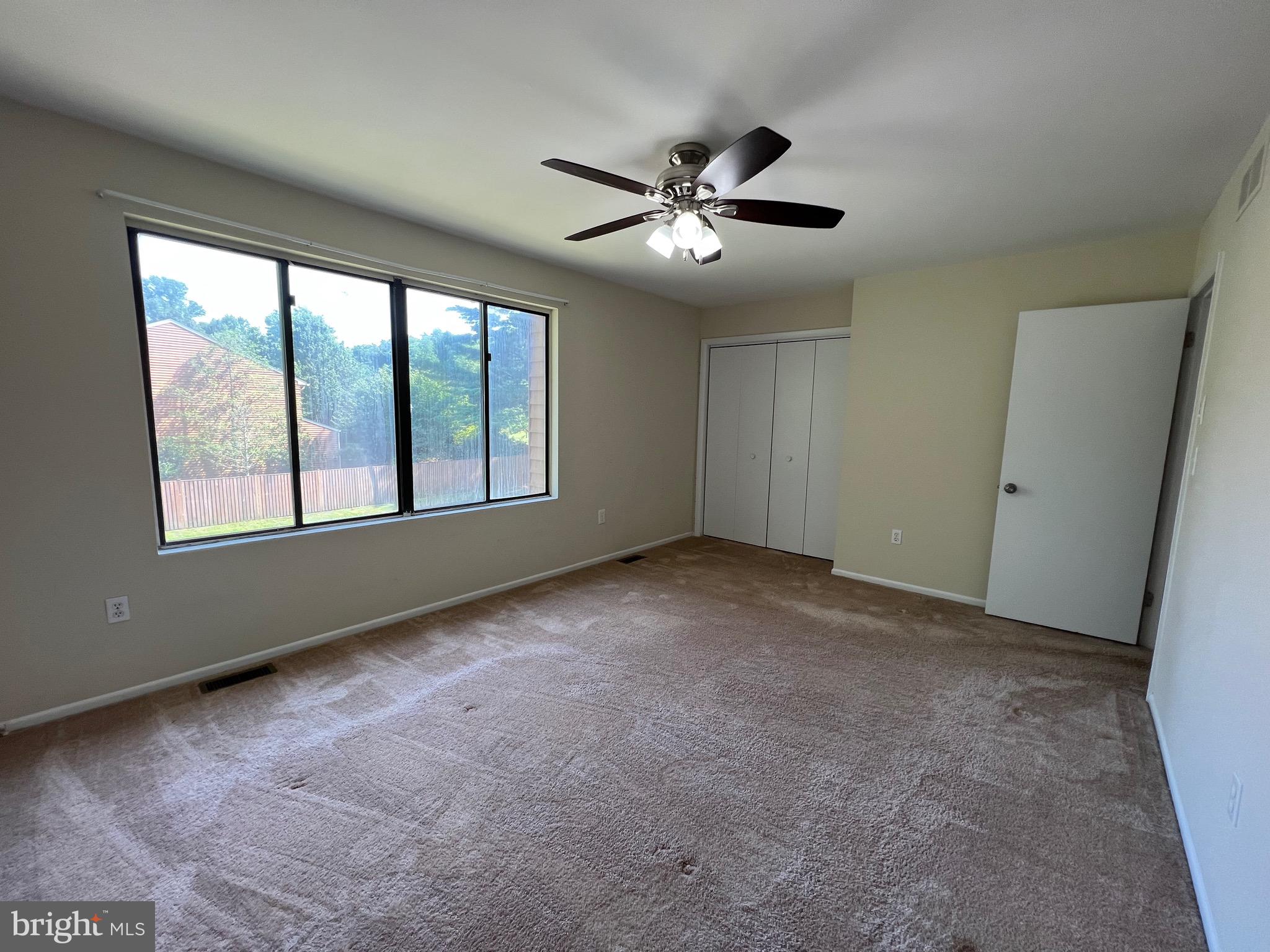 1010 Commanders Way North Annapolis, MD 21409 - Photo 21 of 33 a view of an empty room with chandelier fan and fire place