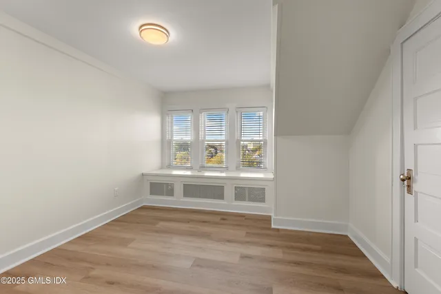 a view of kitchen and wooden floor
