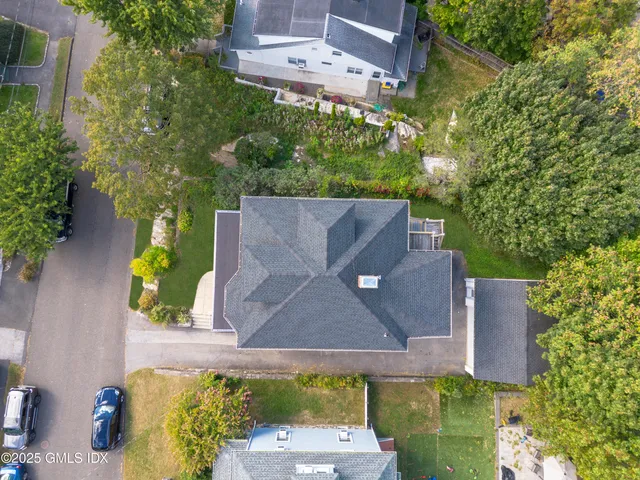 an aerial view of a house with a garden
