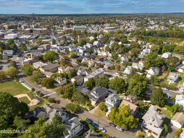 an aerial view of a residential houses with outdoor space