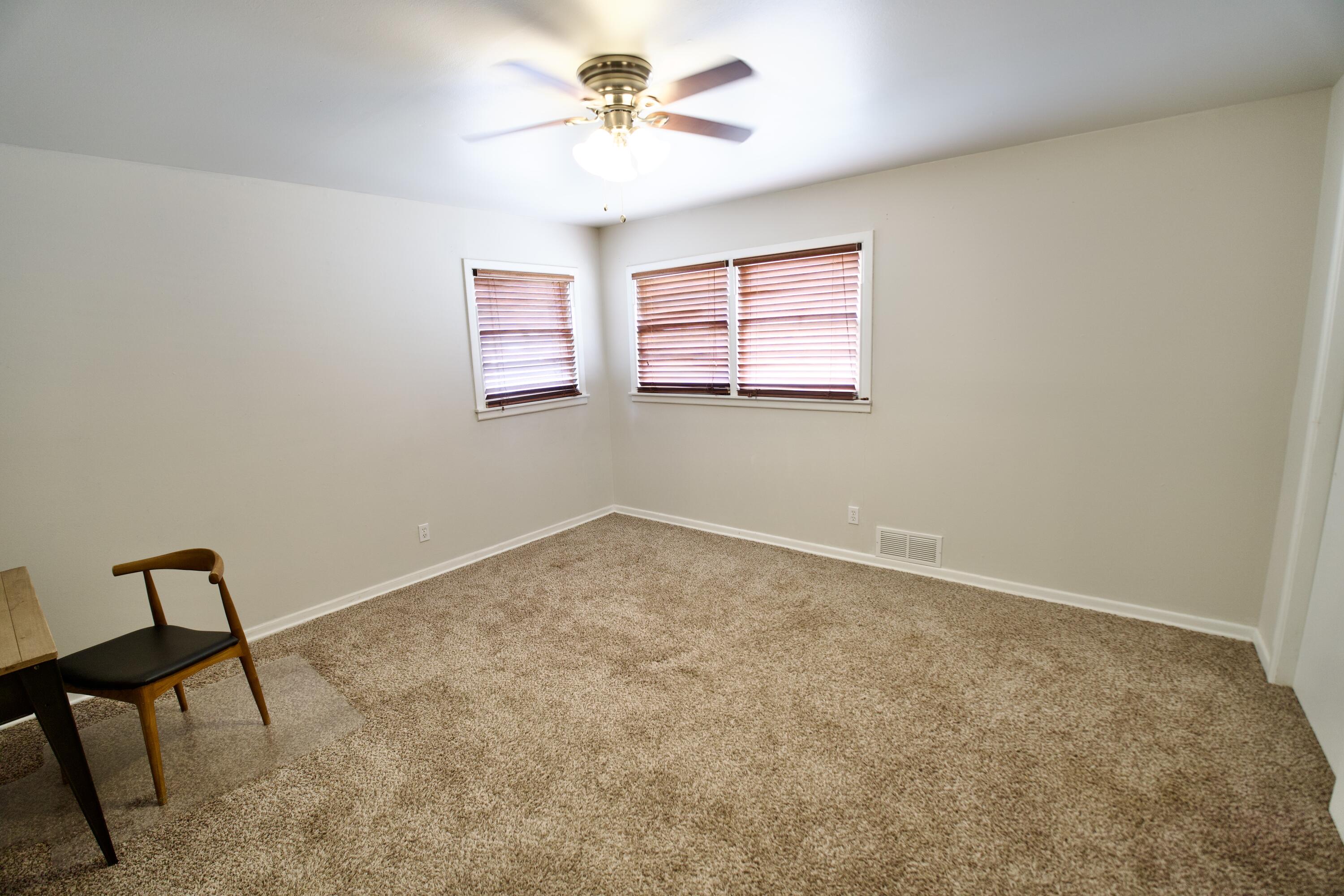 3412 42nd Street Lubbock, TX 79413 - Photo 11 of 17 a view of an empty room with a window