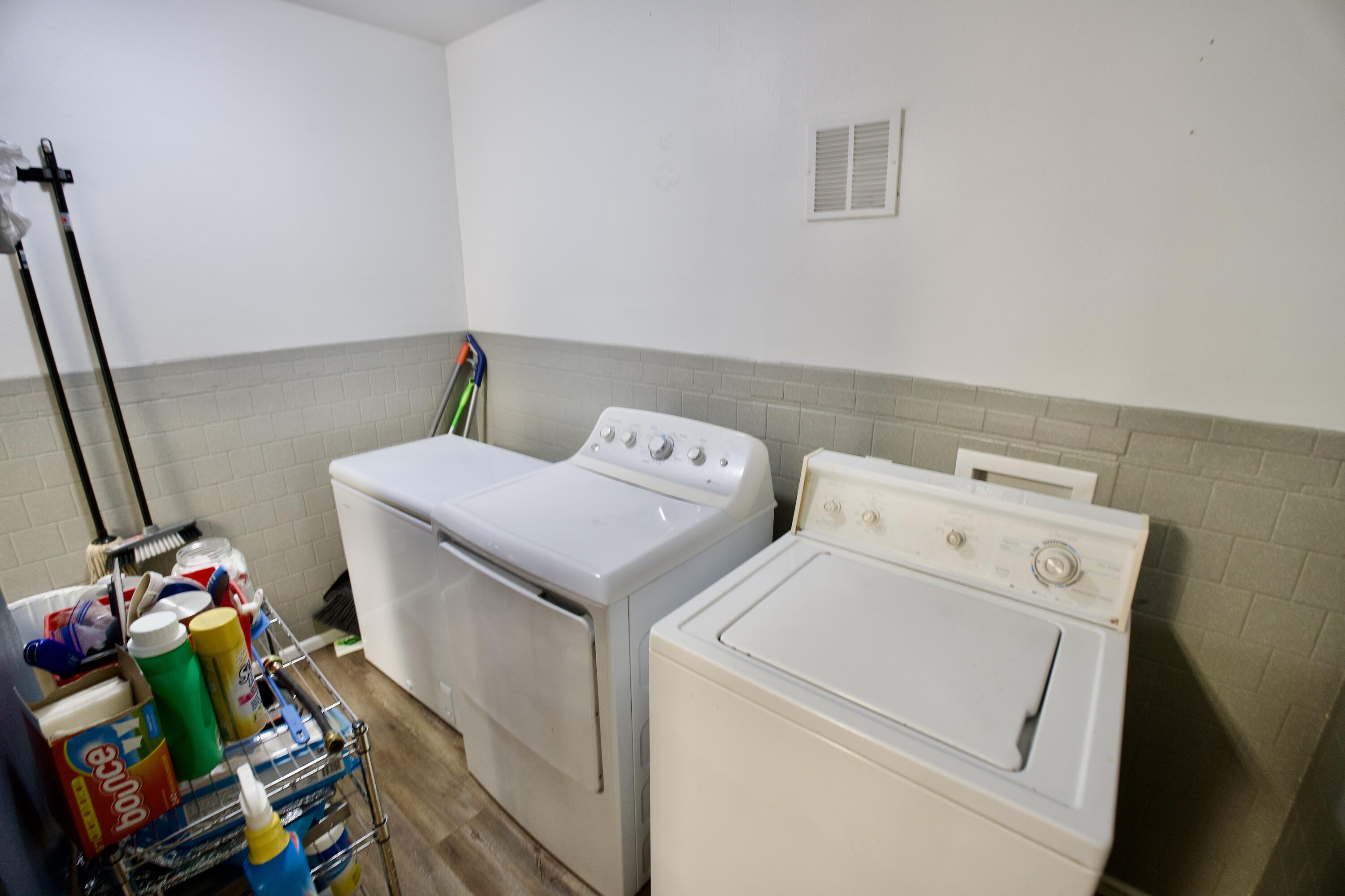 3412 42nd Street Lubbock, TX 79413 - Photo 13 of 17 a utility room with dryer and washer