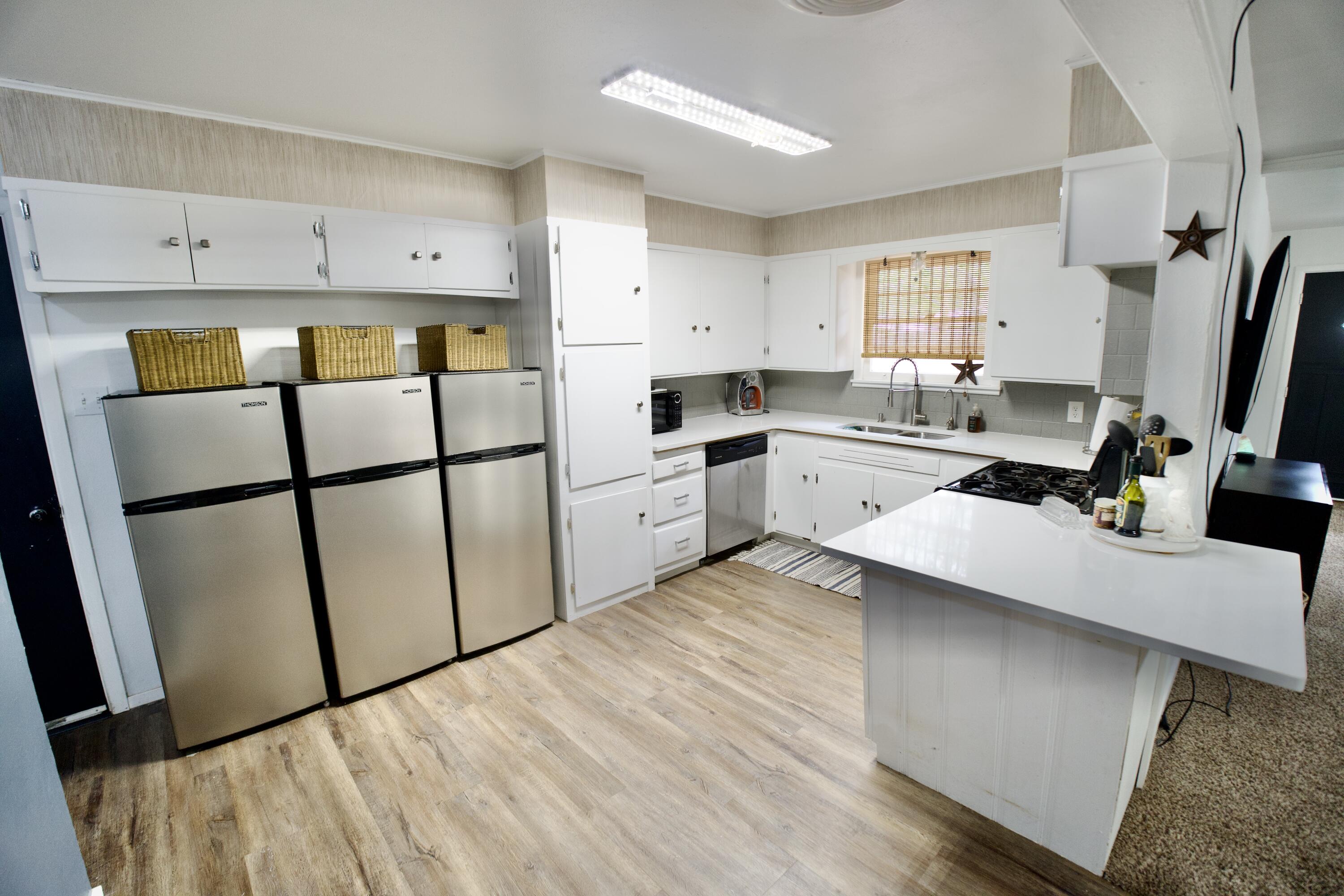 3412 42nd Street Lubbock, TX 79413 - Photo 2 of 17 a kitchen with stainless steel appliances a refrigerator sink and cabinets