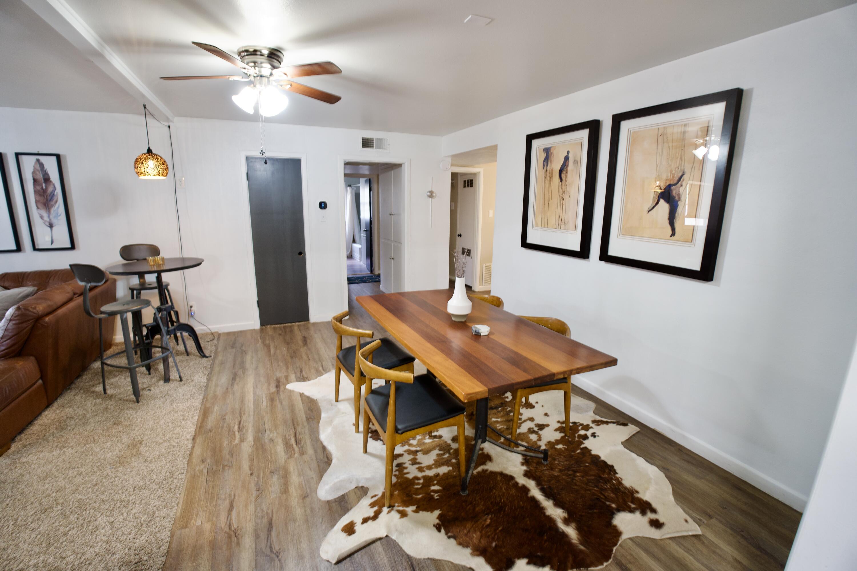 3412 42nd Street Lubbock, TX 79413 - Photo 4 of 17 a view of a dining room with furniture and wooden floor