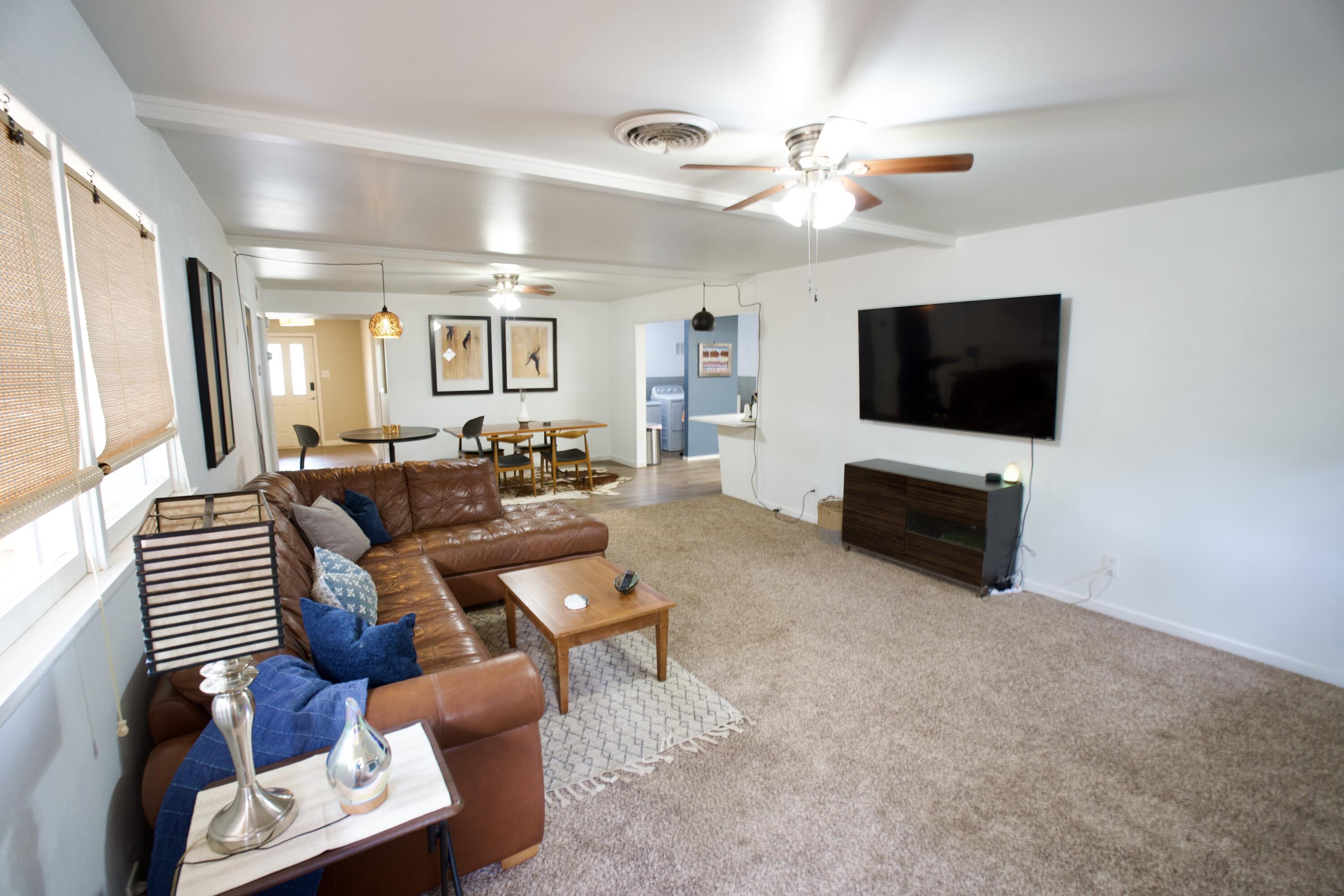 3412 42nd Street Lubbock, TX 79413 - Photo 7 of 17 a living room with furniture and a flat screen tv