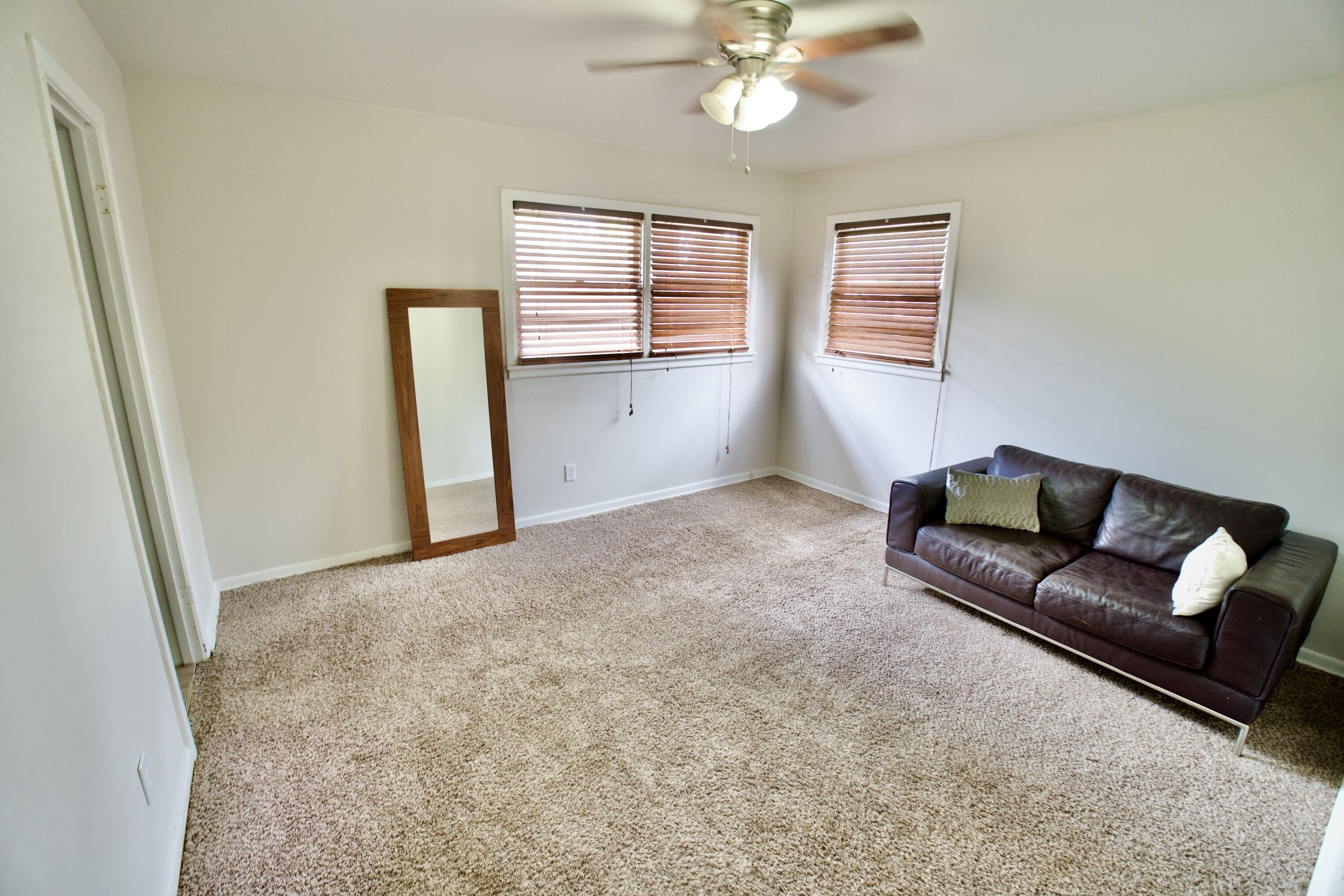 3412 42nd Street Lubbock, TX 79413 - Photo 10 of 17 a living room with furniture and a window
