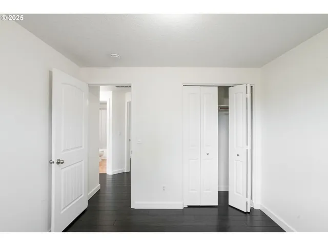 a bathroom with a sink toilet a mirror and shower