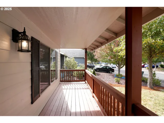 a balcony with wooden floor