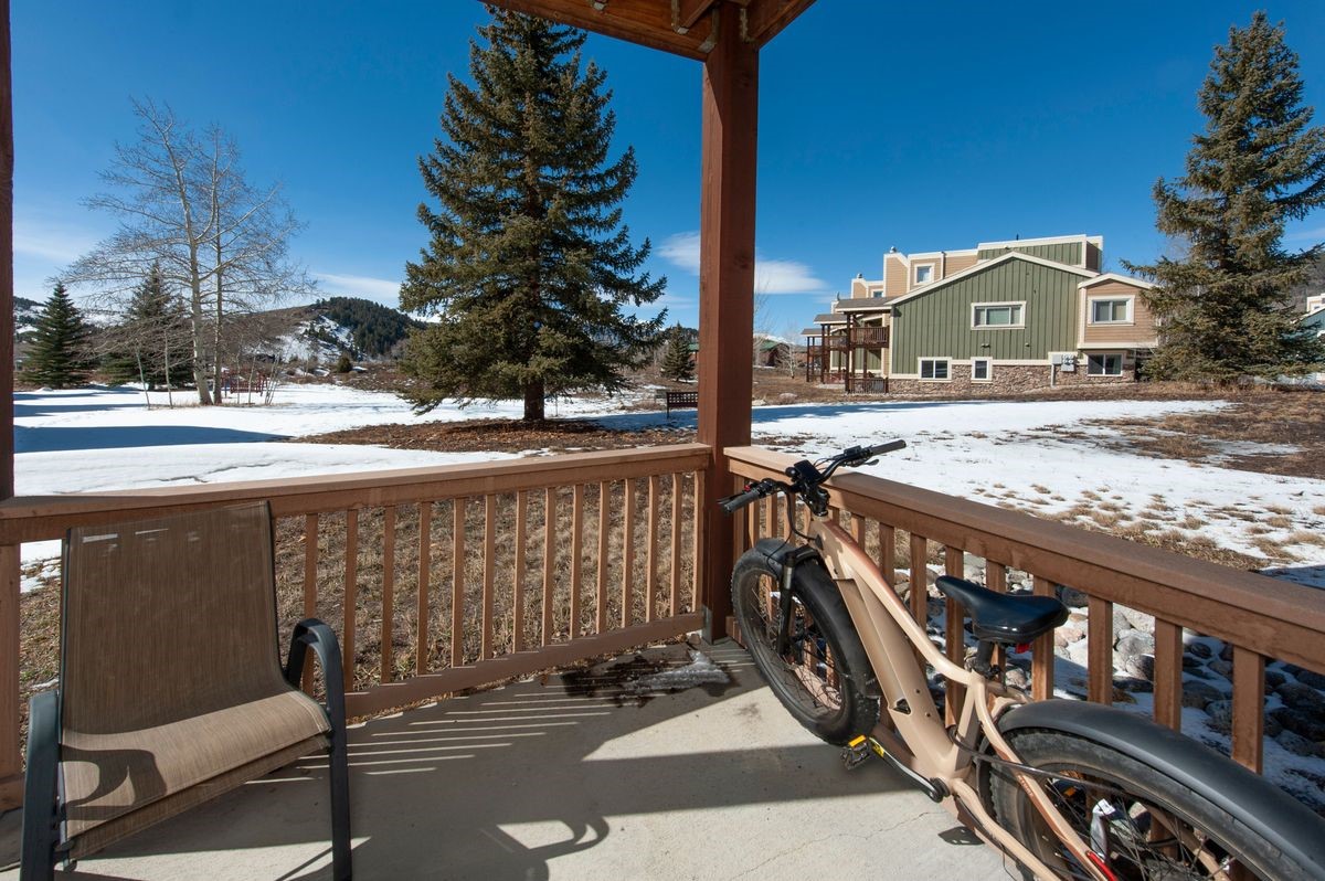 58 Summit Drive, Unit D9 Dillon, CO 80435 - Photo 12 of 34 Ground Floor deck walking out to open space with views of the Gore Range