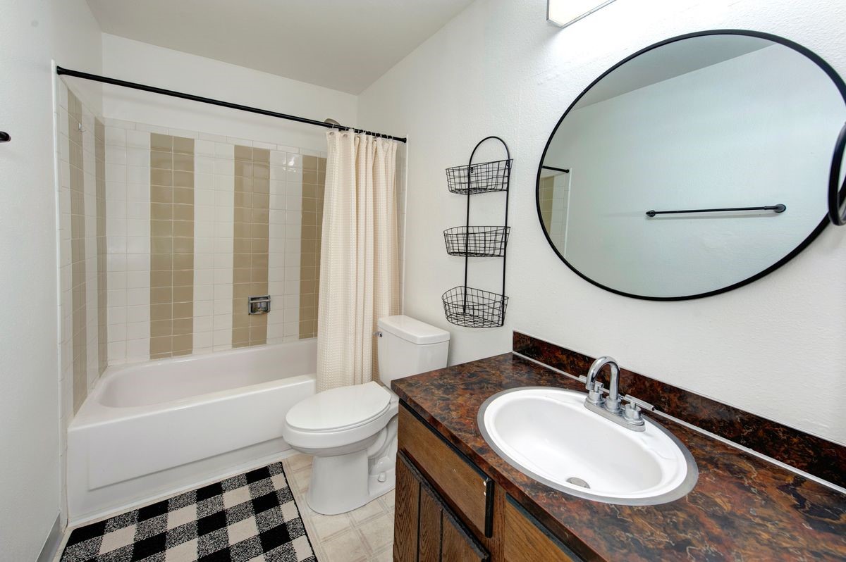 58 Summit Drive, Unit D9 Dillon, CO 80435 - Photo 29 of 34 Full bath with vanity and shower / tub combo with curtain