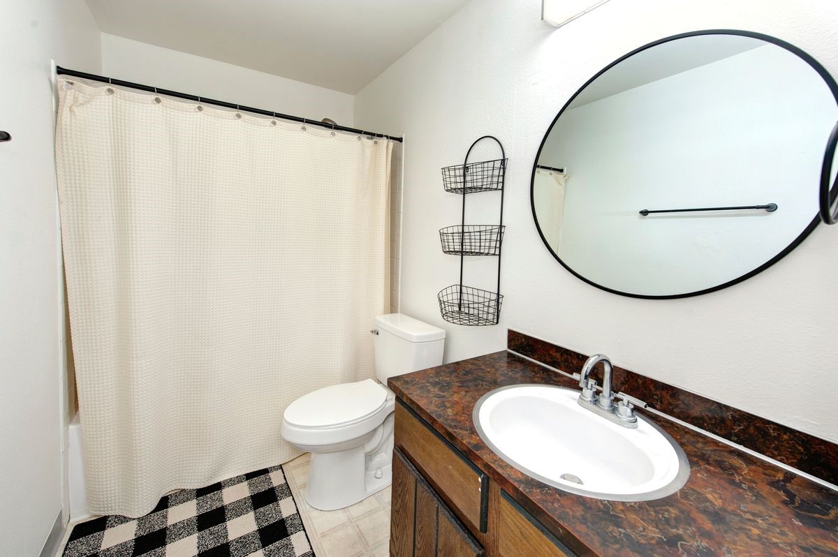58 Summit Drive, Unit D9 Dillon, CO 80435 - Photo 30 of 34 Bathroom with vanity and shower / tub combo with curtain