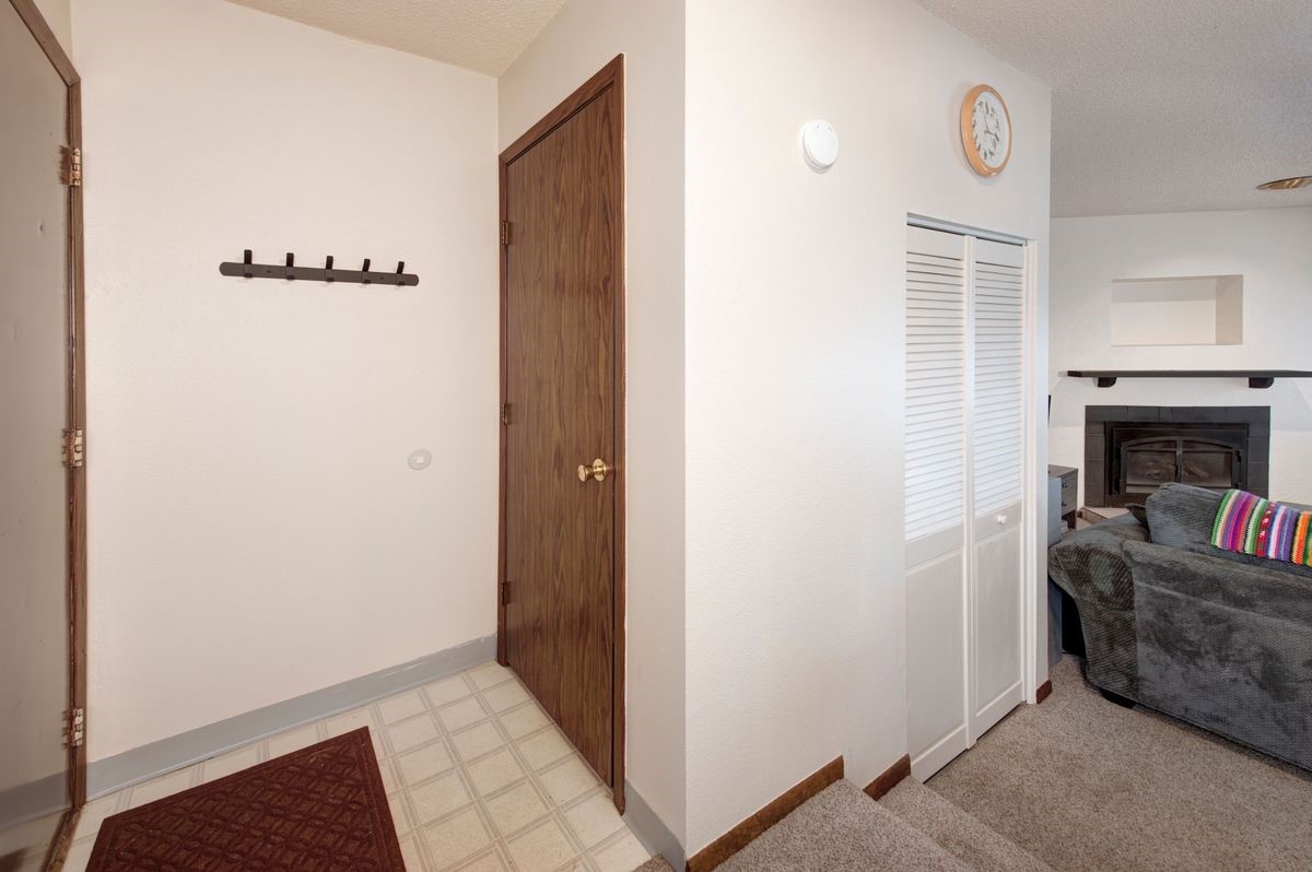 58 Summit Drive, Unit D9 Dillon, CO 80435 - Photo 10 of 34 Hallway with light floors and a textured ceiling