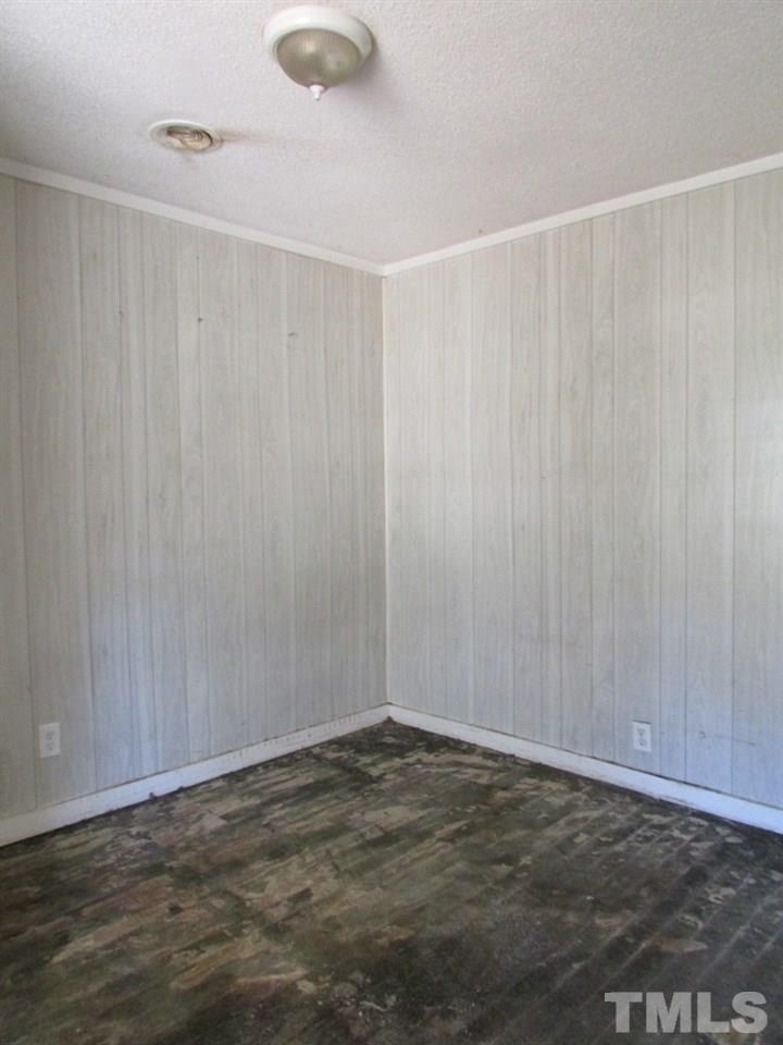 58 A & 58b Thaxton Road Roxboro, NC 27573 - Photo 12 of 16 a view of a room with a wooden floor