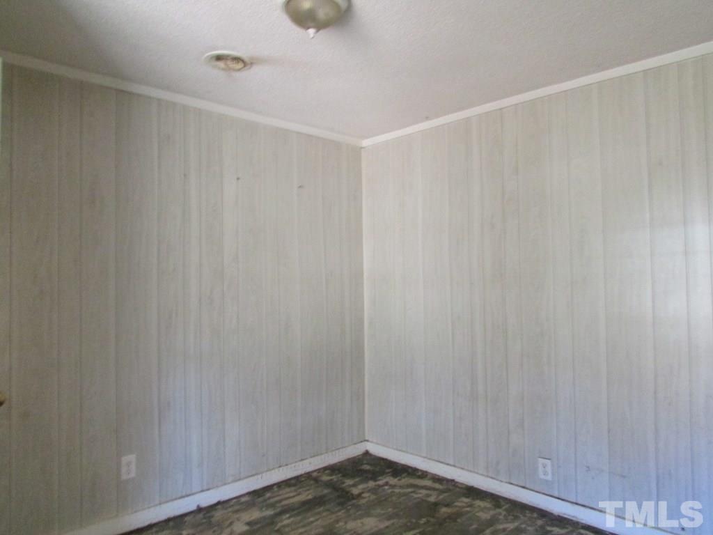 58 A & 58b Thaxton Road Roxboro, NC 27573 - Photo 14 of 16 a view of a room with wooden walls