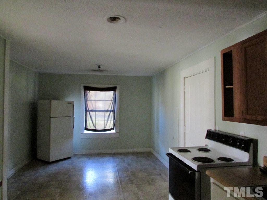 58 A & 58b Thaxton Road Roxboro, NC 27573 - Photo 4 of 16 a kitchen that has a microwave and a sink in it