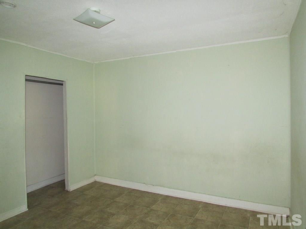 58 A & 58b Thaxton Road Roxboro, NC 27573 - Photo 8 of 16 an empty room with a bench