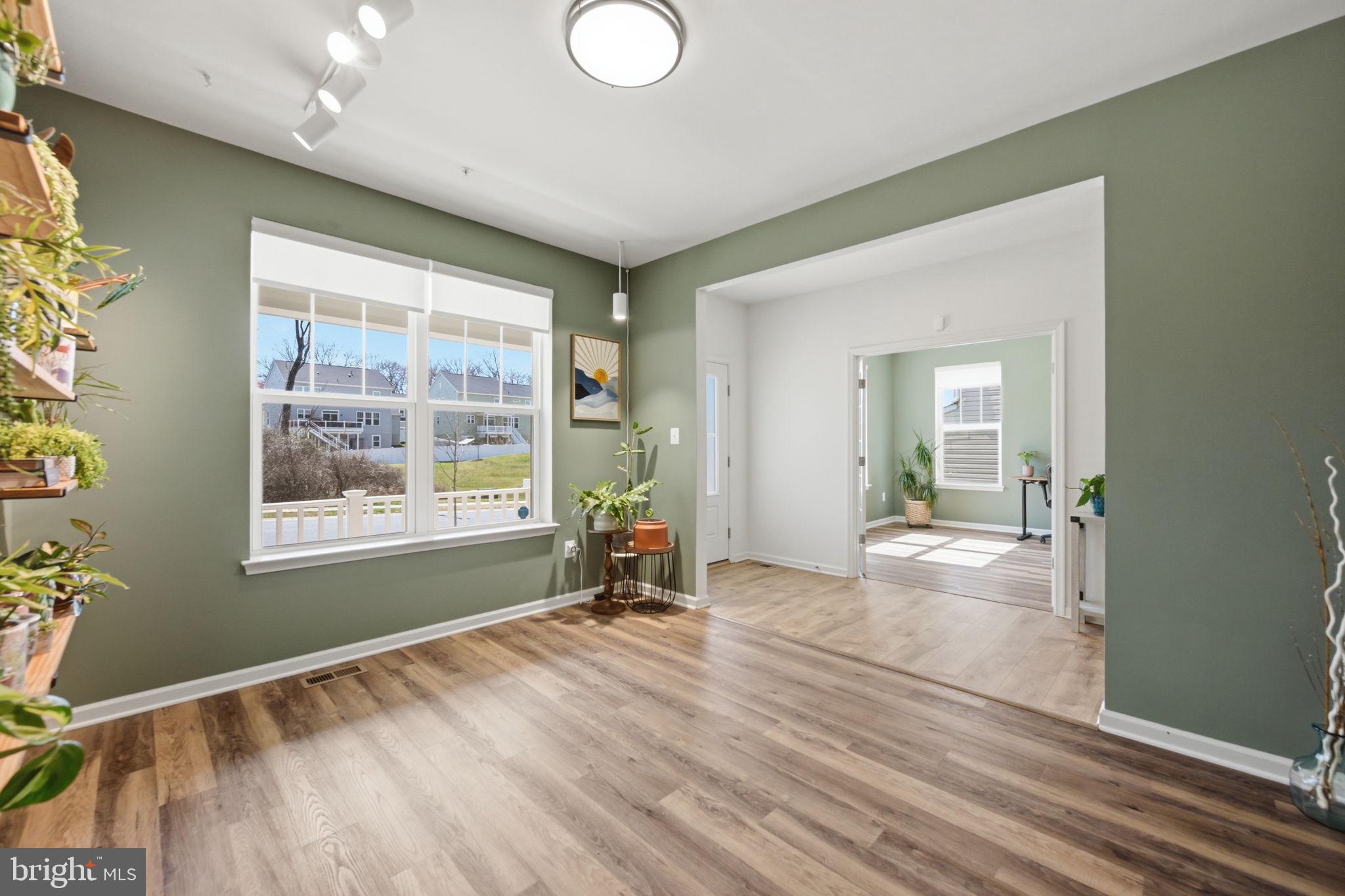 2397 Terrapin Crossing Jessup, MD 20794 - Photo 13 of 40 a view of an empty room with wooden floor and a window