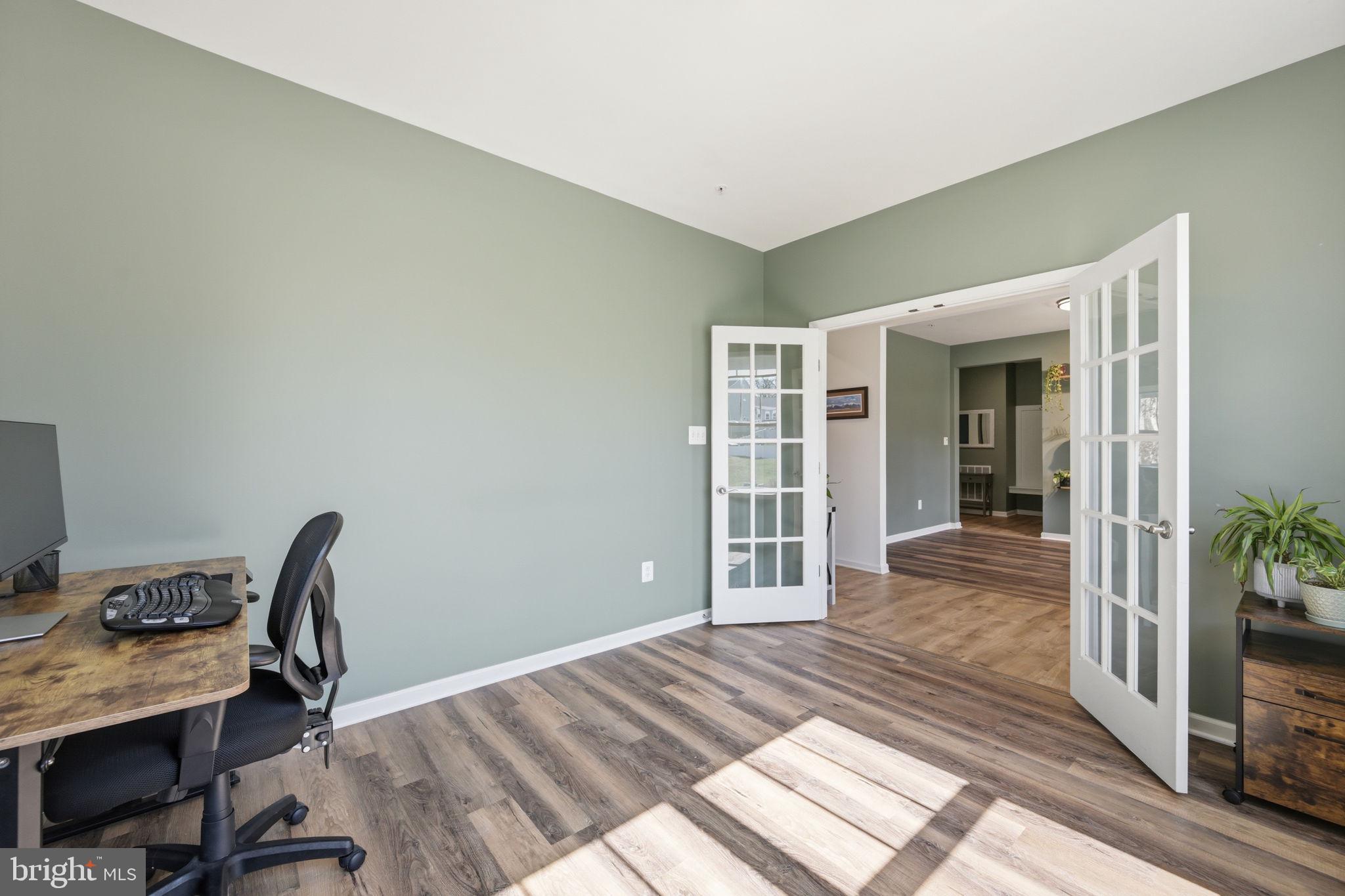 2397 Terrapin Crossing Jessup, MD 20794 - Photo 16 of 40 a view of a workspace with wooden floor and a window