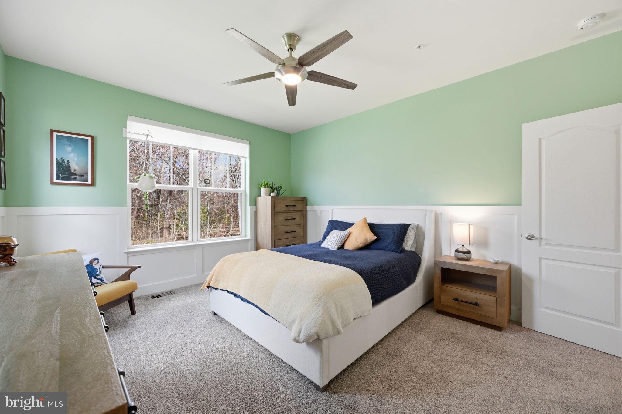 2397 Terrapin Crossing Jessup, MD 20794 - Photo 18 of 40 a bedroom with a bed a window and a couch