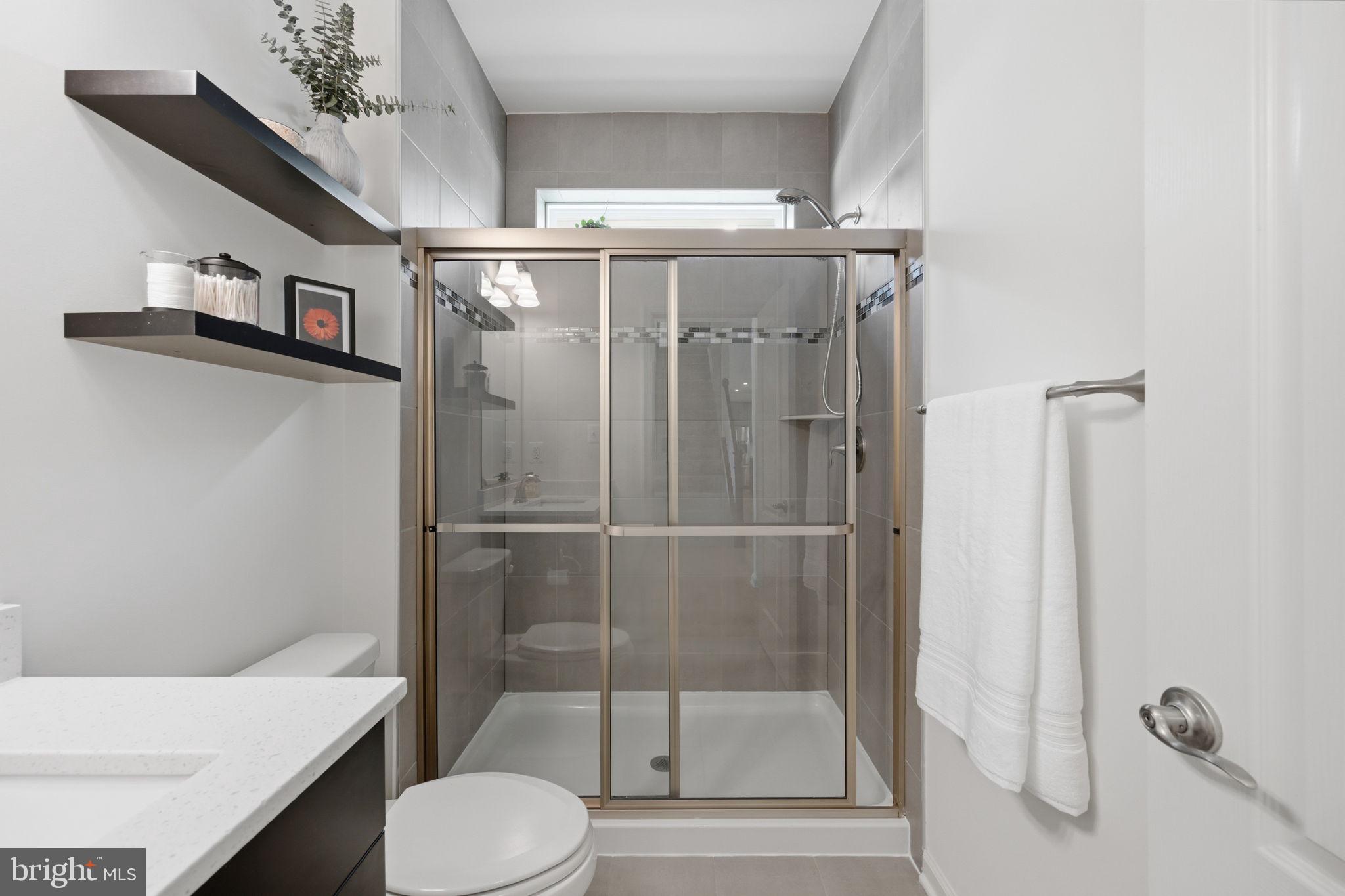 2397 Terrapin Crossing Jessup, MD 20794 - Photo 20 of 40 a bathroom with a shower a toilet and a sink
