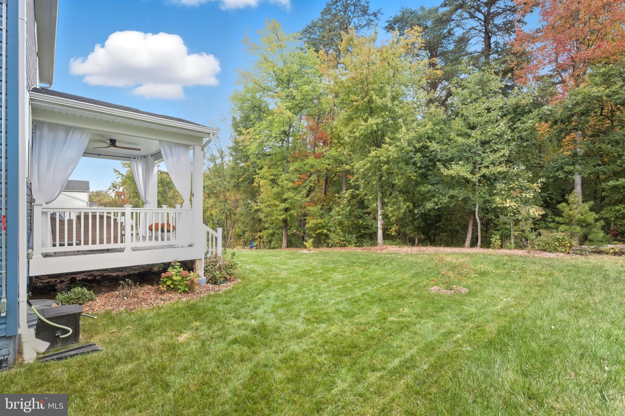 2397 Terrapin Crossing Jessup, MD 20794 - Photo 2 of 40 a view of a chair and table in backyard of the house