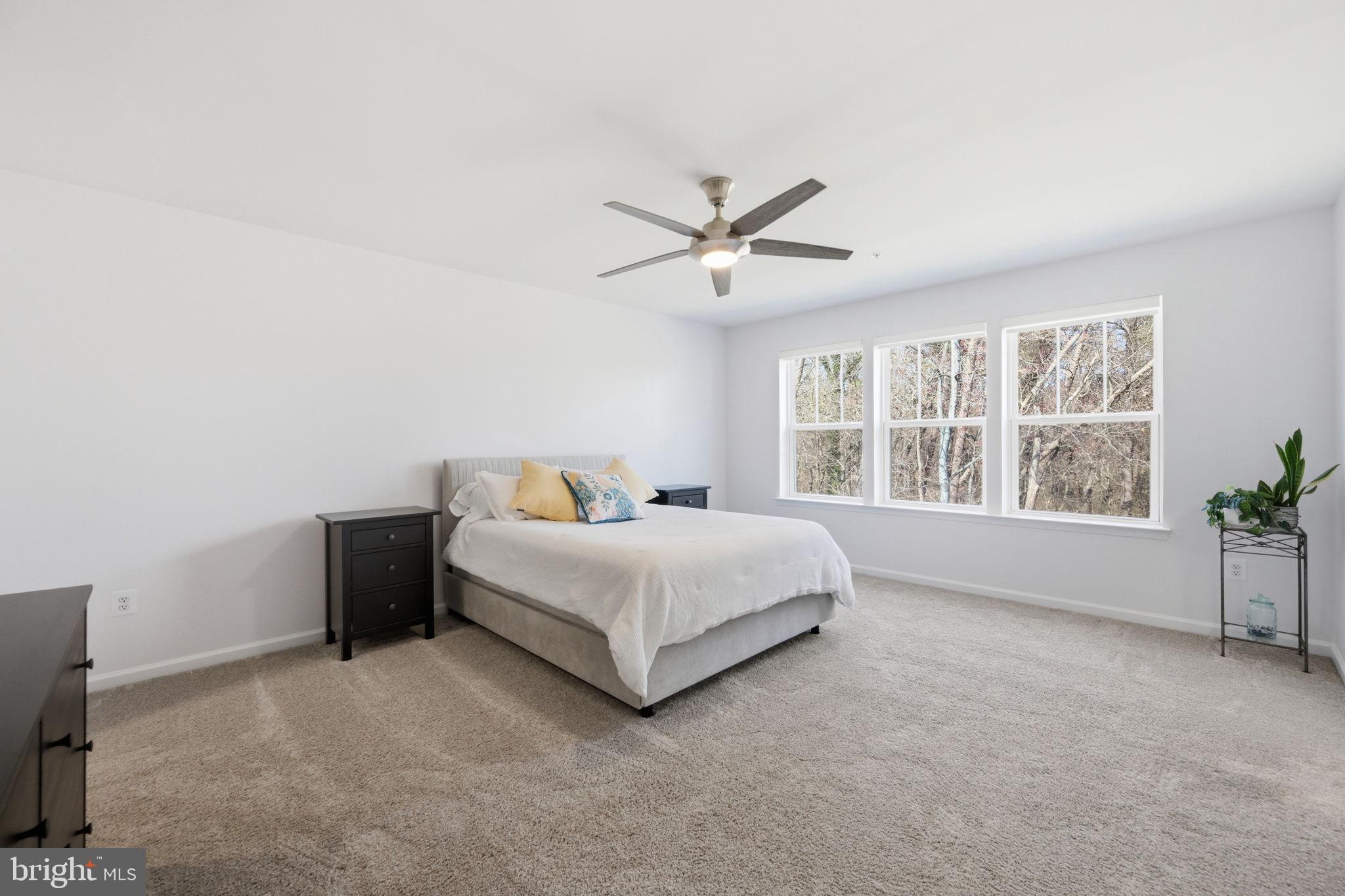 2397 Terrapin Crossing Jessup, MD 20794 - Photo 22 of 40 a spacious bedroom with a bed and a large window