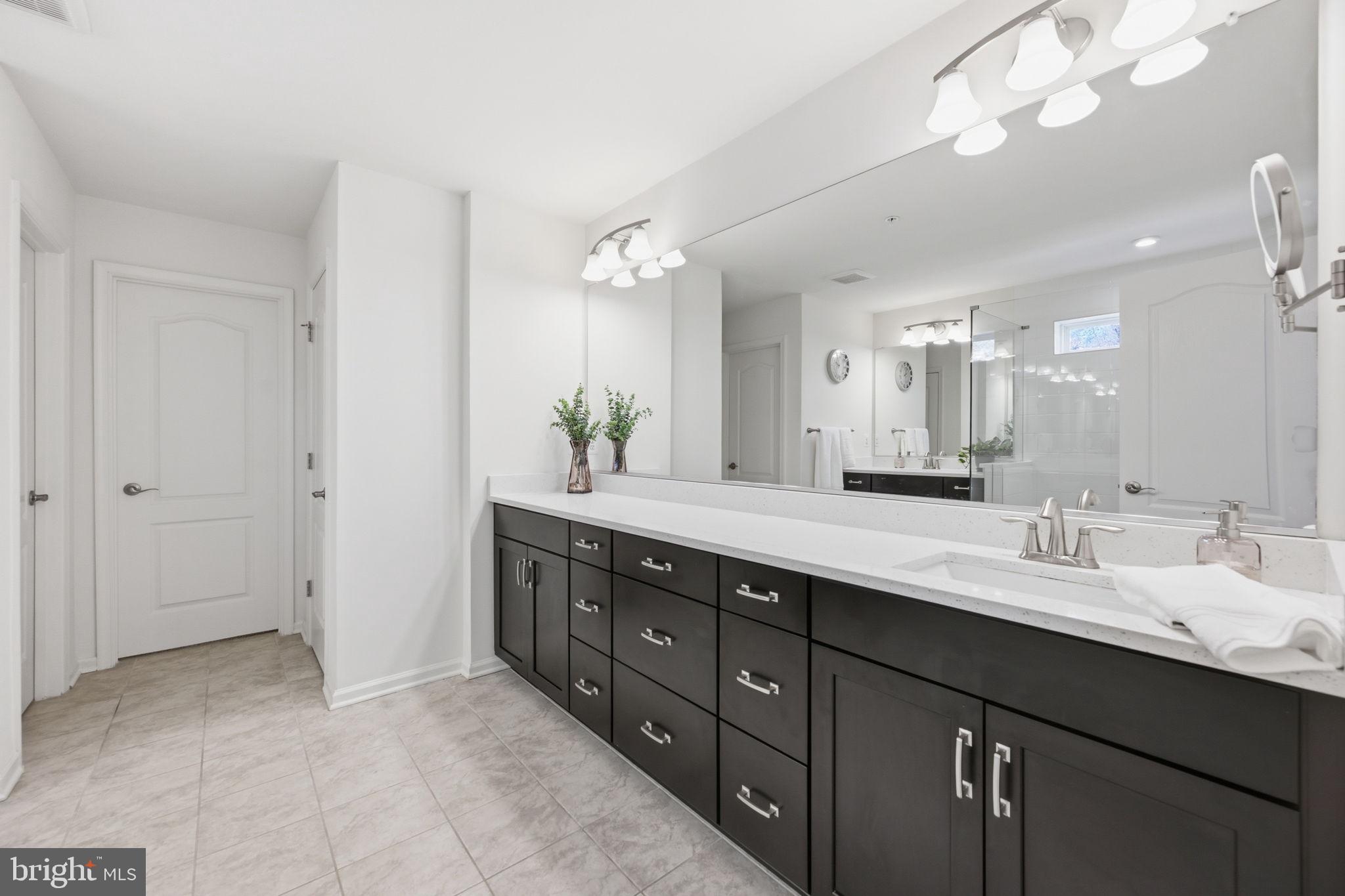 2397 Terrapin Crossing Jessup, MD 20794 - Photo 26 of 40 a bathroom with a double vanity sink and a mirror