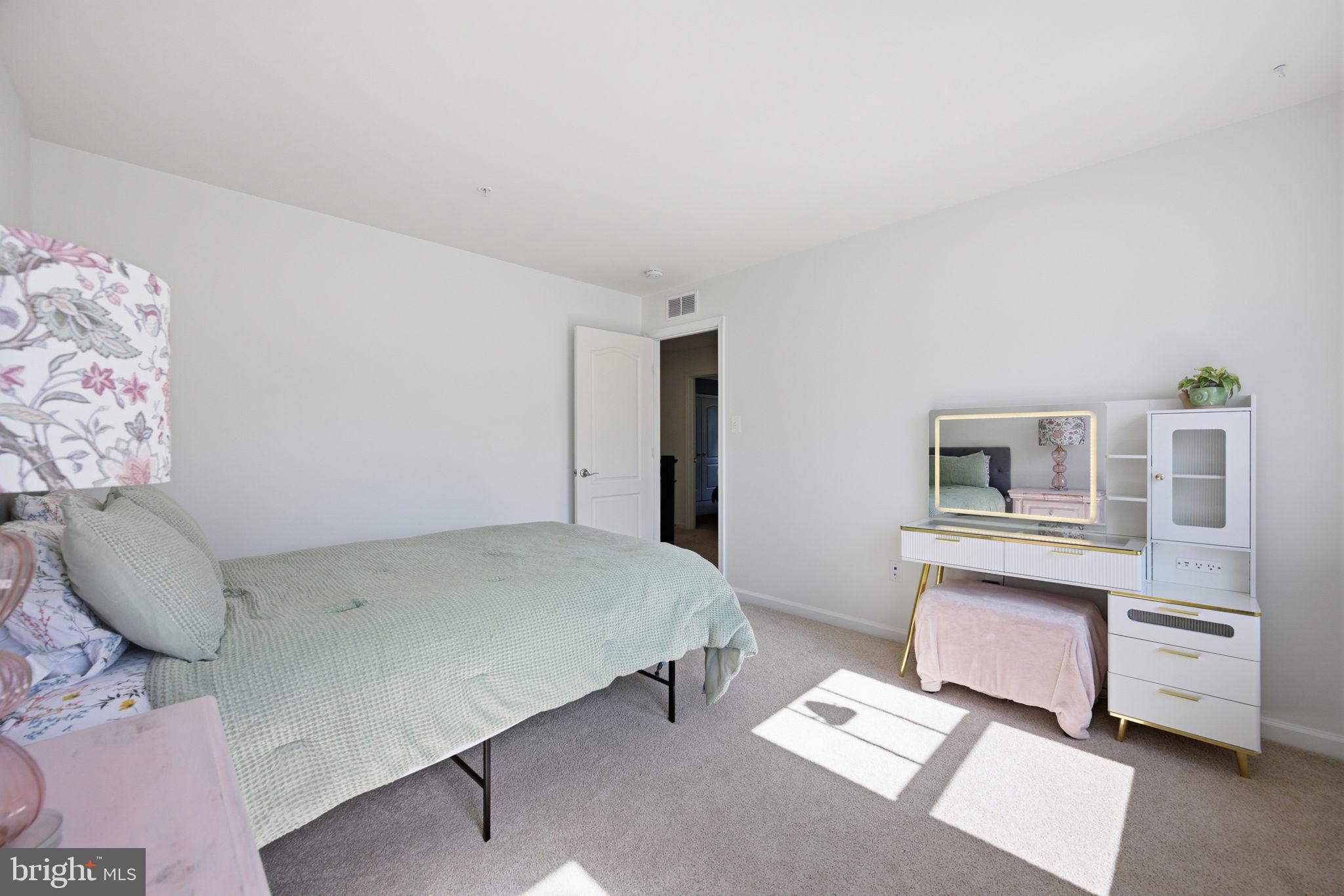 2397 Terrapin Crossing Jessup, MD 20794 - Photo 28 of 40 a bedroom with a bed and a couch