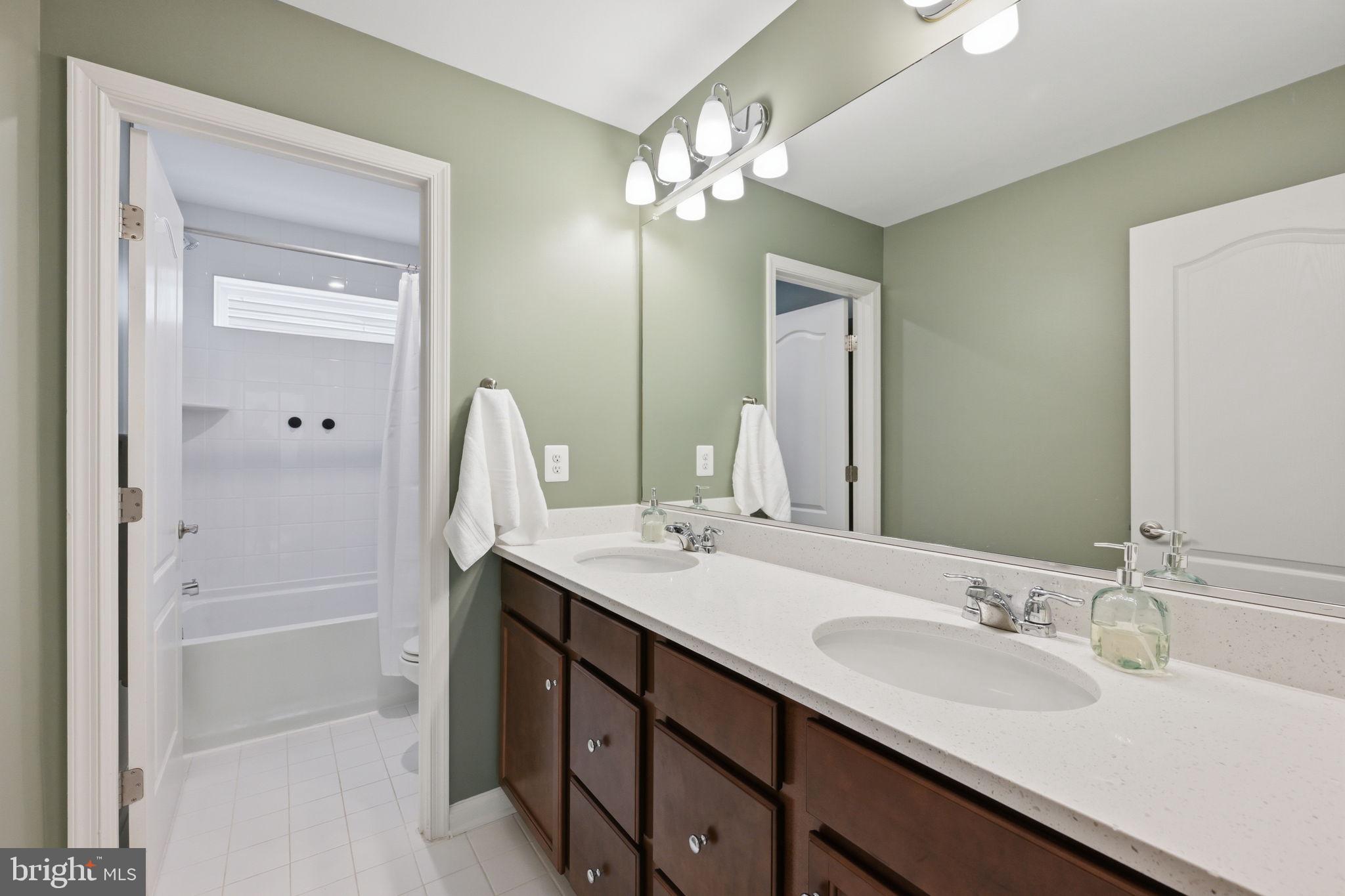 2397 Terrapin Crossing Jessup, MD 20794 - Photo 31 of 40 a bathroom with a sink double vanity and a mirror