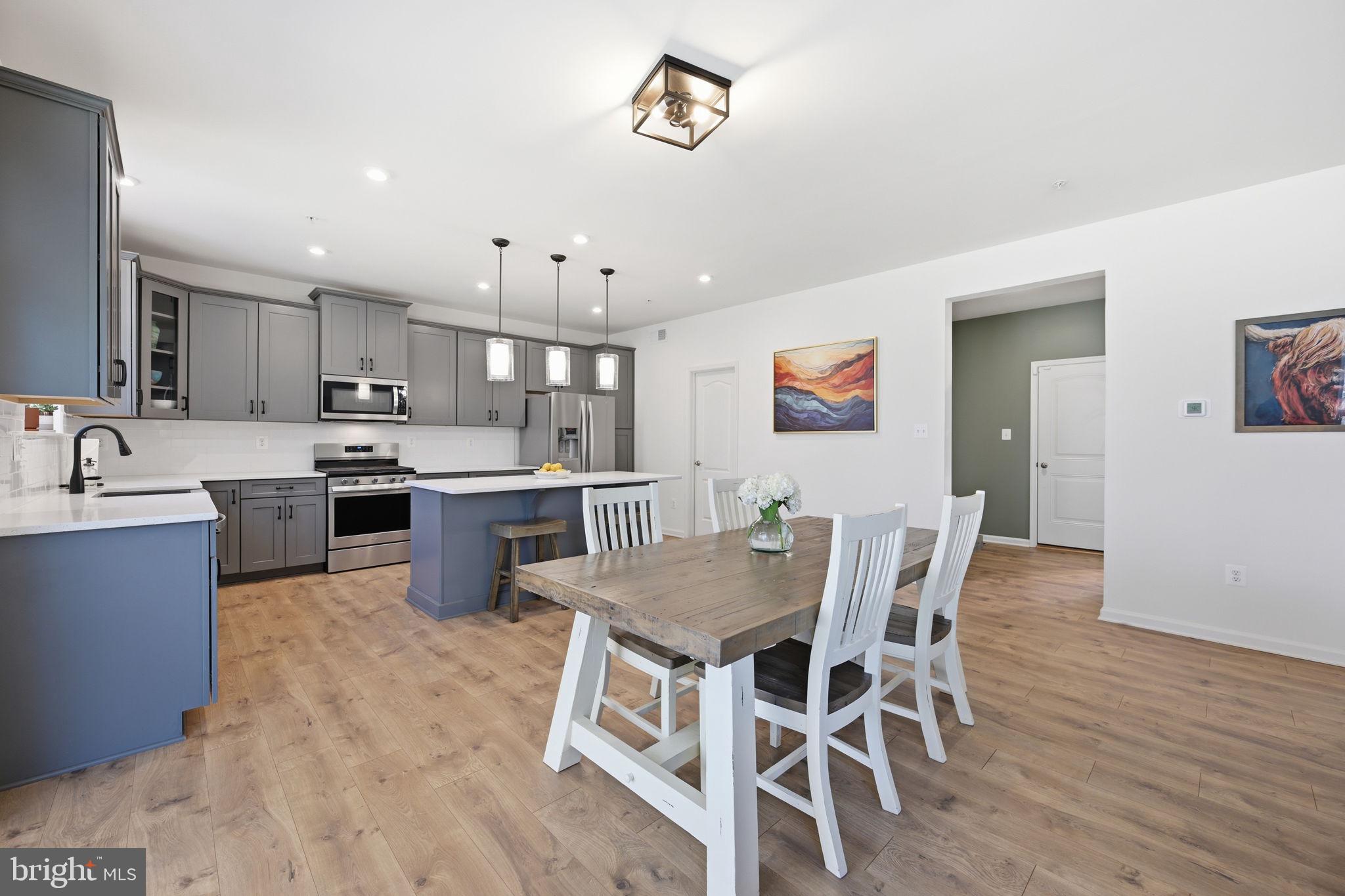 2397 Terrapin Crossing Jessup, MD 20794 - Photo 7 of 40 a view of kitchen with cabinets table and chairs
