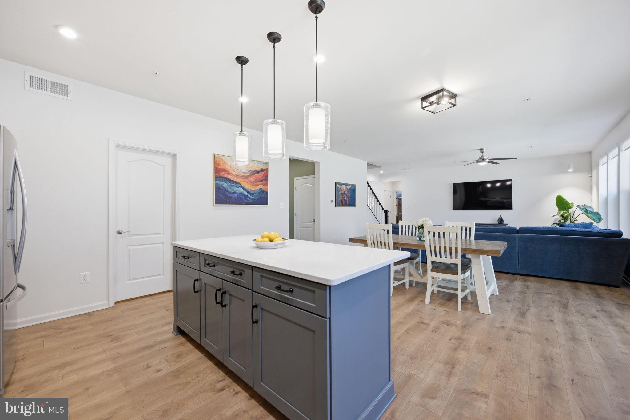 2397 Terrapin Crossing Jessup, MD 20794 - Photo 9 of 40 a room with furniture a flat screen tv and a view of kitchen