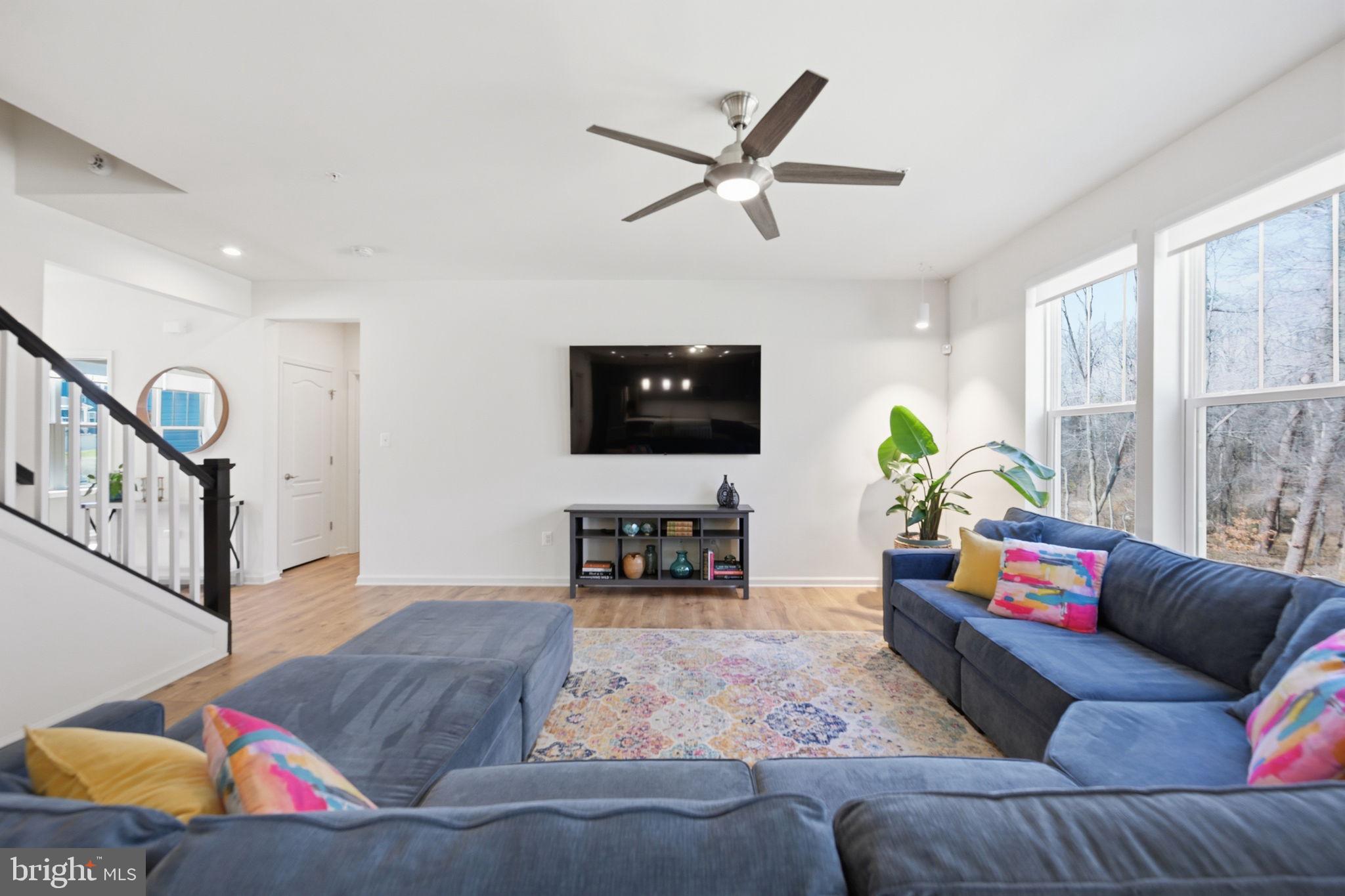 2397 Terrapin Crossing Jessup, MD 20794 - Photo 10 of 40 a living room with furniture and a wooden floor