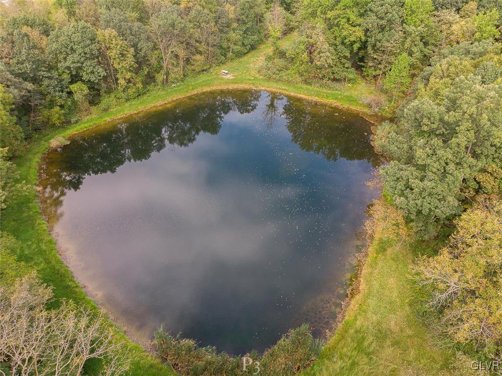 474 Sportsman Club Road Nazareth, PA 18064 - Photo 3 of 14 a view of a lake with a yard