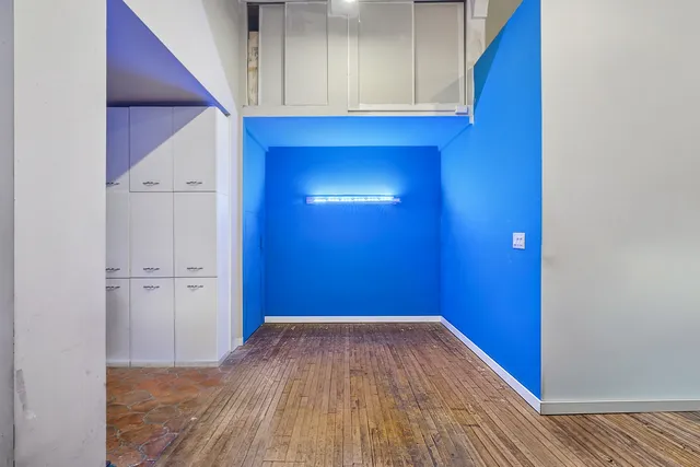 a kitchen with stainless steel appliances granite countertop a refrigerator and a stove