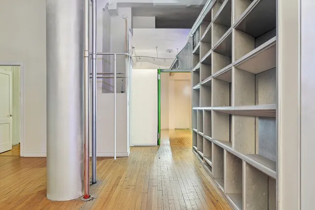 a view of a kitchen with wooden floor