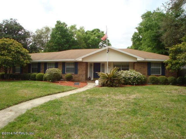 3980 Heidi Road West Jacksonville, FL 32277 - Photo 1 of 46 a front view of a house with a yard