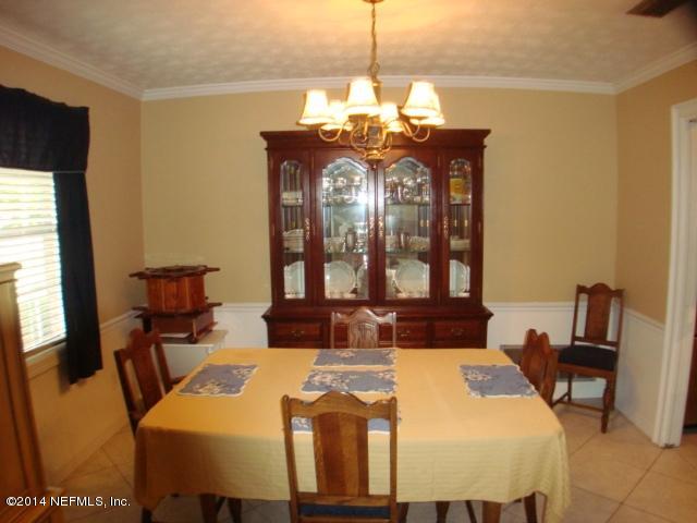 3980 Heidi Road West Jacksonville, FL 32277 - Photo 15 of 46 a view of a dining room with furniture and window