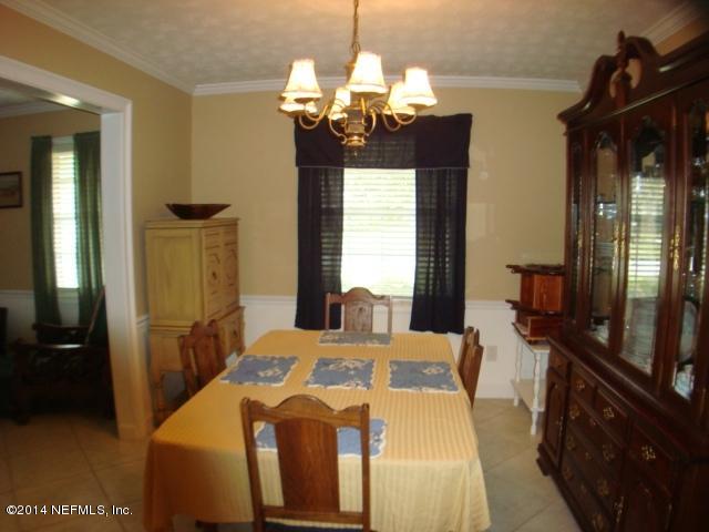 3980 Heidi Road West Jacksonville, FL 32277 - Photo 16 of 46 a bedroom with bed and window