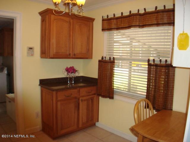 3980 Heidi Road West Jacksonville, FL 32277 - Photo 22 of 46 a bathroom with a sink a mirror and a window