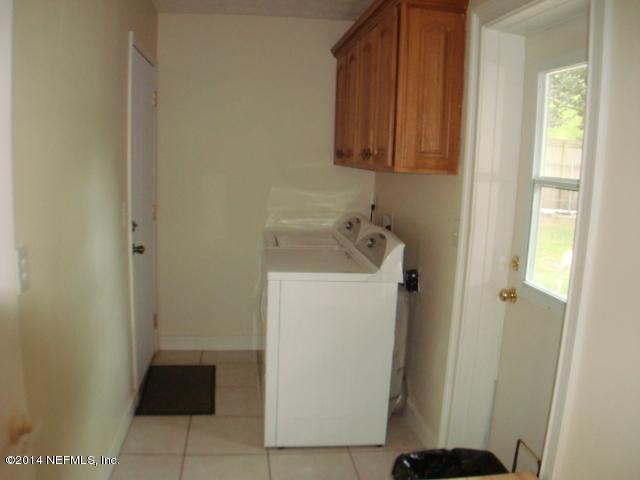 3980 Heidi Road West Jacksonville, FL 32277 - Photo 23 of 46 a utility room with dryer and washer