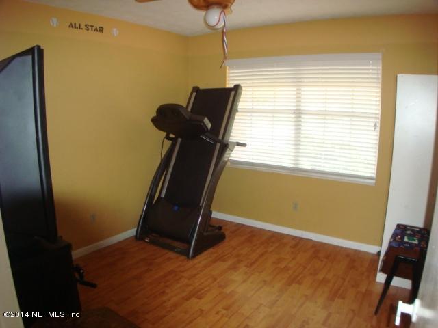 3980 Heidi Road West Jacksonville, FL 32277 - Photo 30 of 46 a room with gym equipment and a window