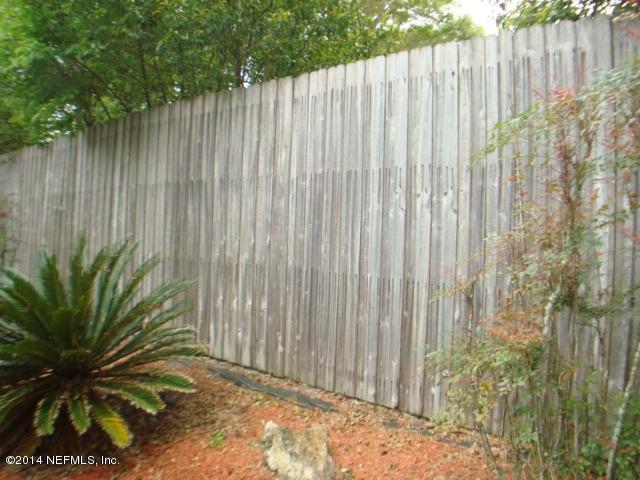 3980 Heidi Road West Jacksonville, FL 32277 - Photo 3 of 46 a view of a wooden fence