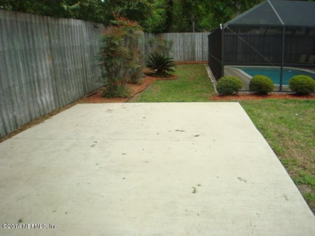 3980 Heidi Road West Jacksonville, FL 32277 - Photo 6 of 46 a view of backyard and tree