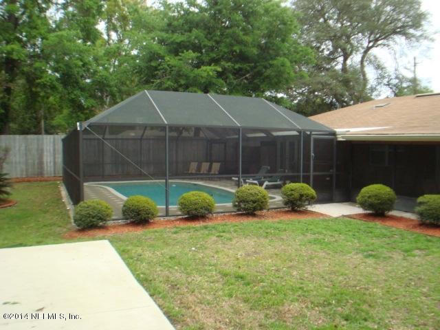 3980 Heidi Road West Jacksonville, FL 32277 - Photo 7 of 46 a view of a house with backyard and a garden