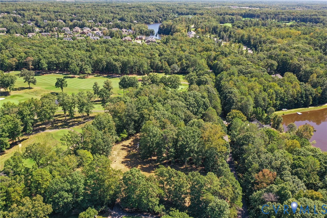 321 1st Flite Lane Manakin-Sabot, VA 23103 - Photo 4 of 11 an aerial view of residential houses with outdoor space and trees