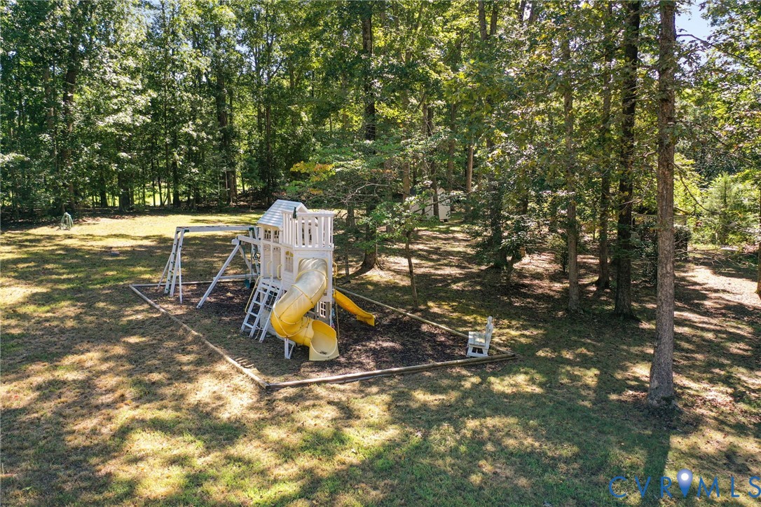 321 1st Flite Lane Manakin-Sabot, VA 23103 - Photo 9 of 11 a view of a small yard with wooden fence